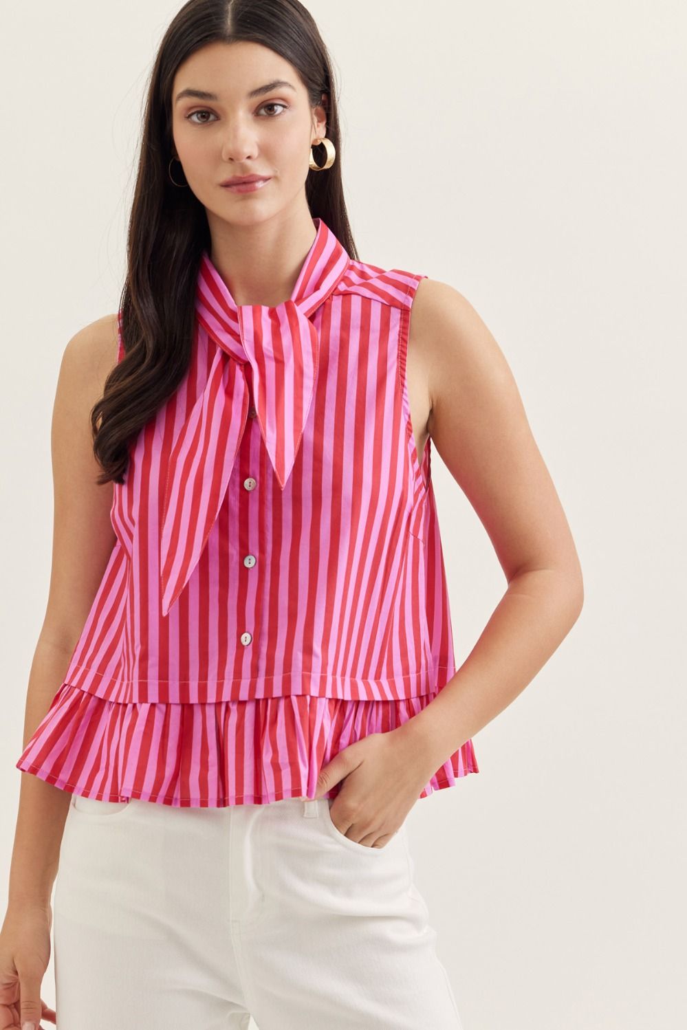 Striped sleeveless peplum top featuring tie neck detail